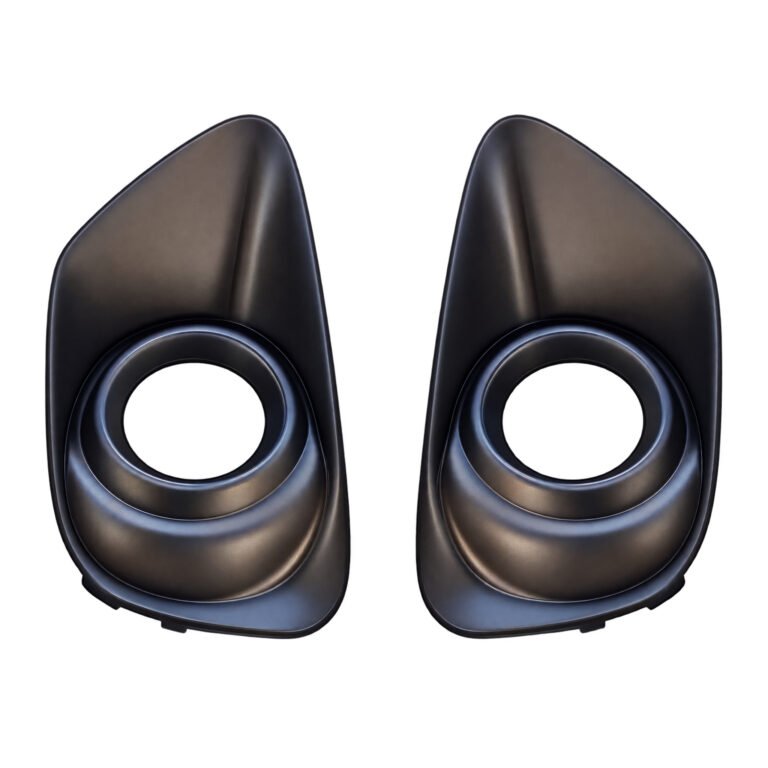 Two dark Compass fog-light surrounds with round openings and tall tapered upper faces