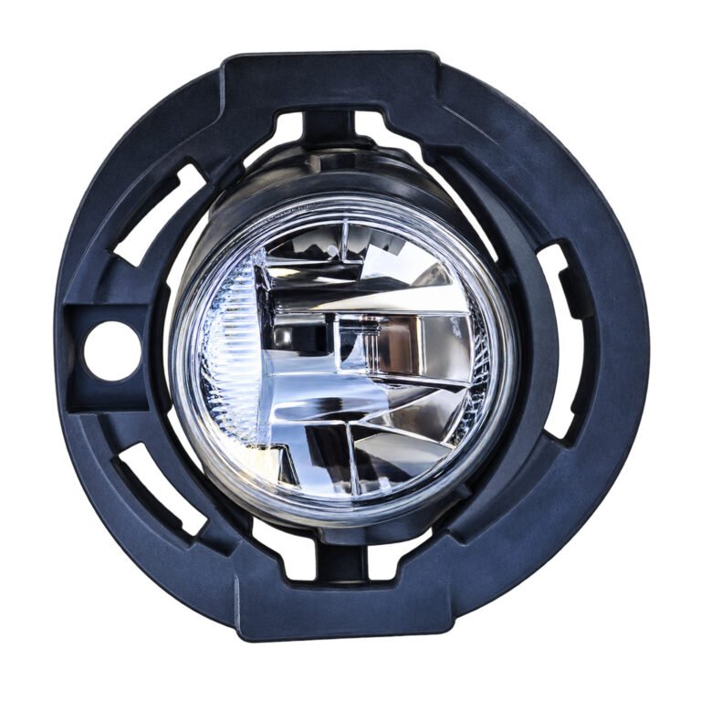 Grand Cherokee circular fog lamp in a wide mounting ring with curved slots and an offset round opening