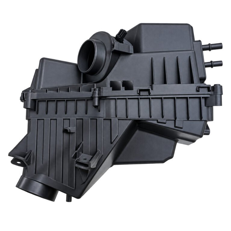 Cherokee air cleaner housing with a raised upper box, ribbed lower section, round connections and central joining seam