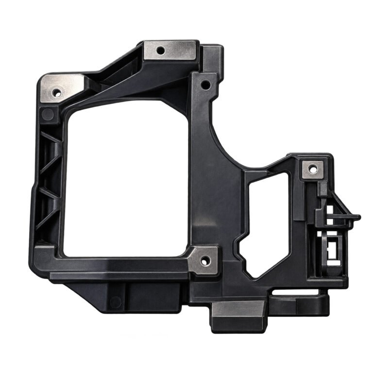 Cherokee headlight bracket with a large rectangular opening, smaller shaped opening and round fixing pads