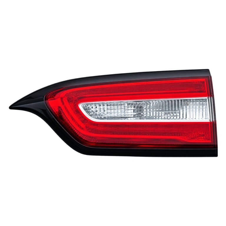 Cherokee inner tail light with a pointed end, clear horizontal lens strip and surrounding red lens