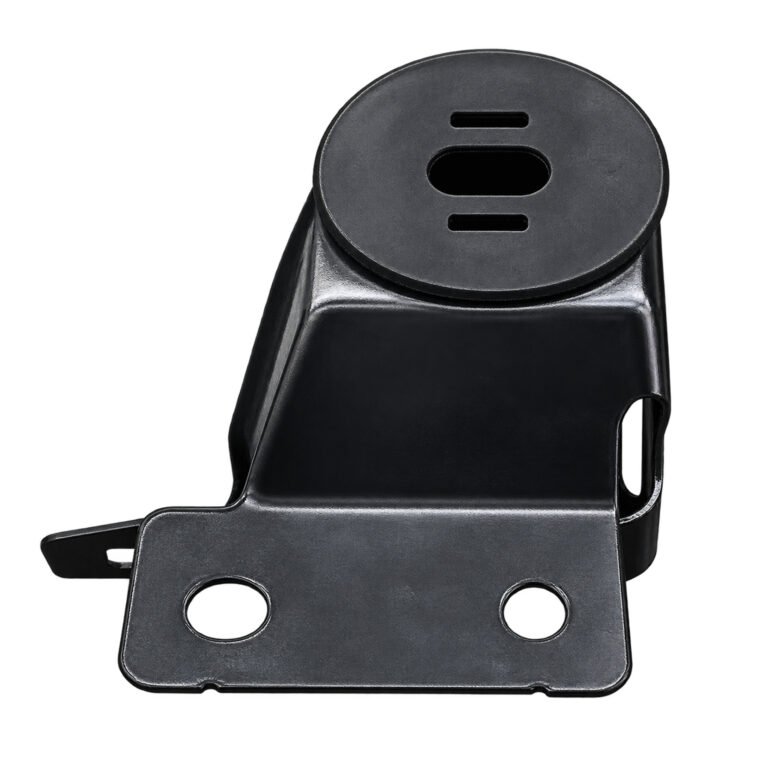 Cherokee radiator support bracket with a slotted round upper pad, formed upright wall and two-hole lower flange