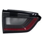 Compass inner tail light with a tapered clear centre, red lower band and angular outer lens edge