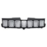 Bright honeycomb faces across seven Grand Cherokee WK2 grille slots within a dark connecting frame
