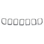 Seven silver inner grille frames for Grand Commander, showing broad stepped lips and rounded end-piece contours