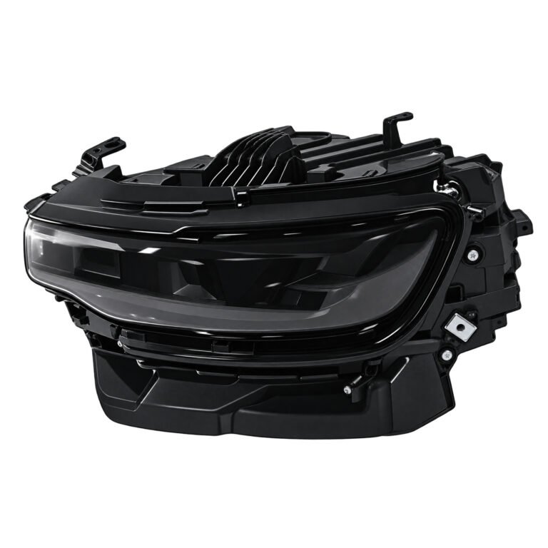 Wagoneer black-surround headlight with upper horizontal lens details, a deep housing and projecting attachment ears