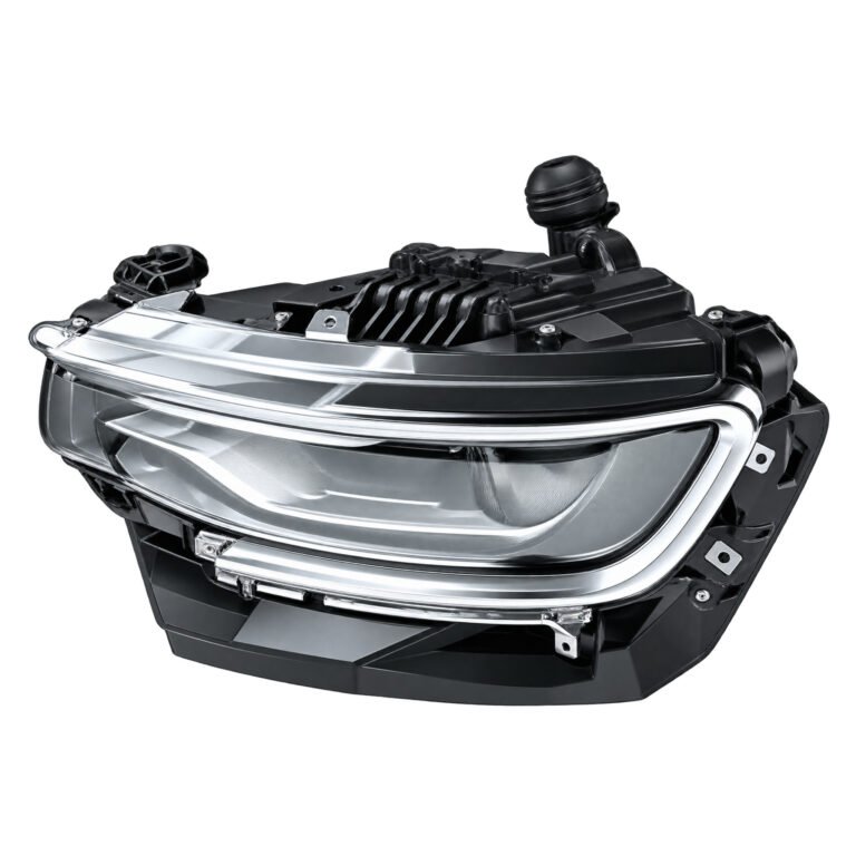 Wagoneer headlight with a bright curved surround, upper horizontal lens details and a deep dark housing