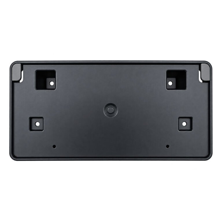 Wagoneer license plate panel with four square fixing recesses, a circular centre boss and clipped upper corners