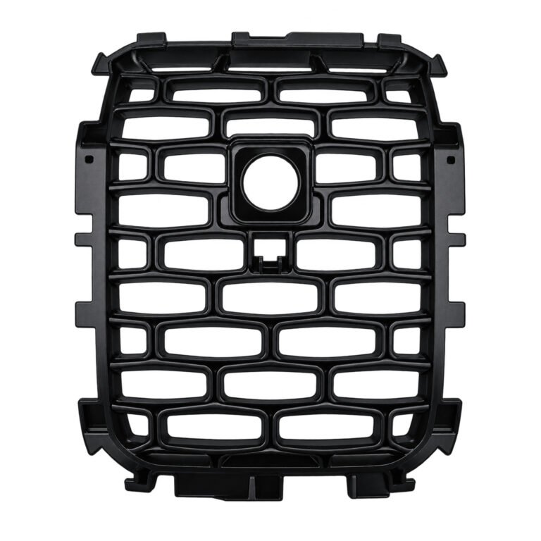 Wagoneer single grille mesh insert with a rounded rectangular border and a circular upper-centre aperture