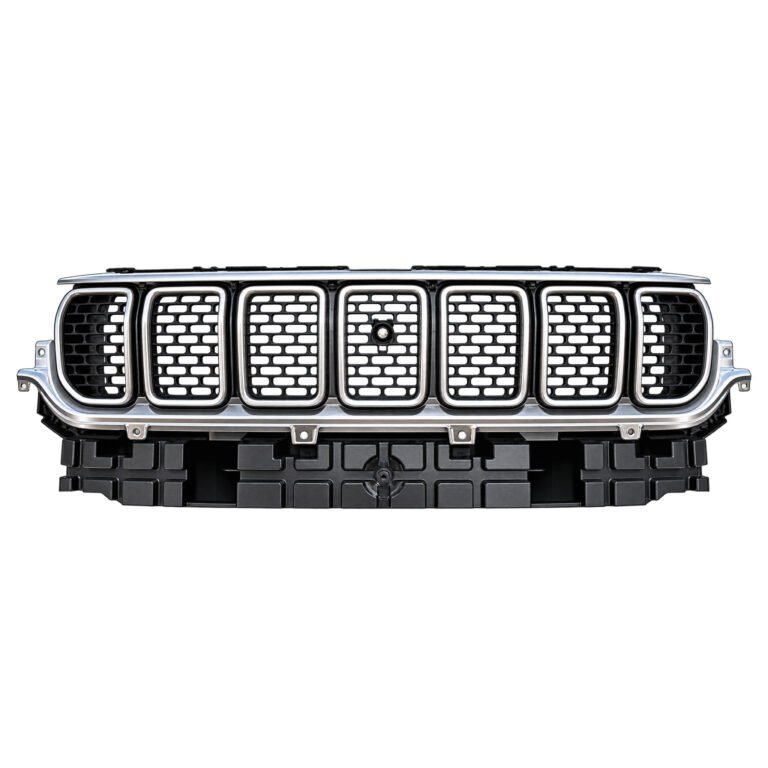 Wagoneer pearl nickel grille with bright slot borders, staggered mesh, a round centre feature and ribbed lower base