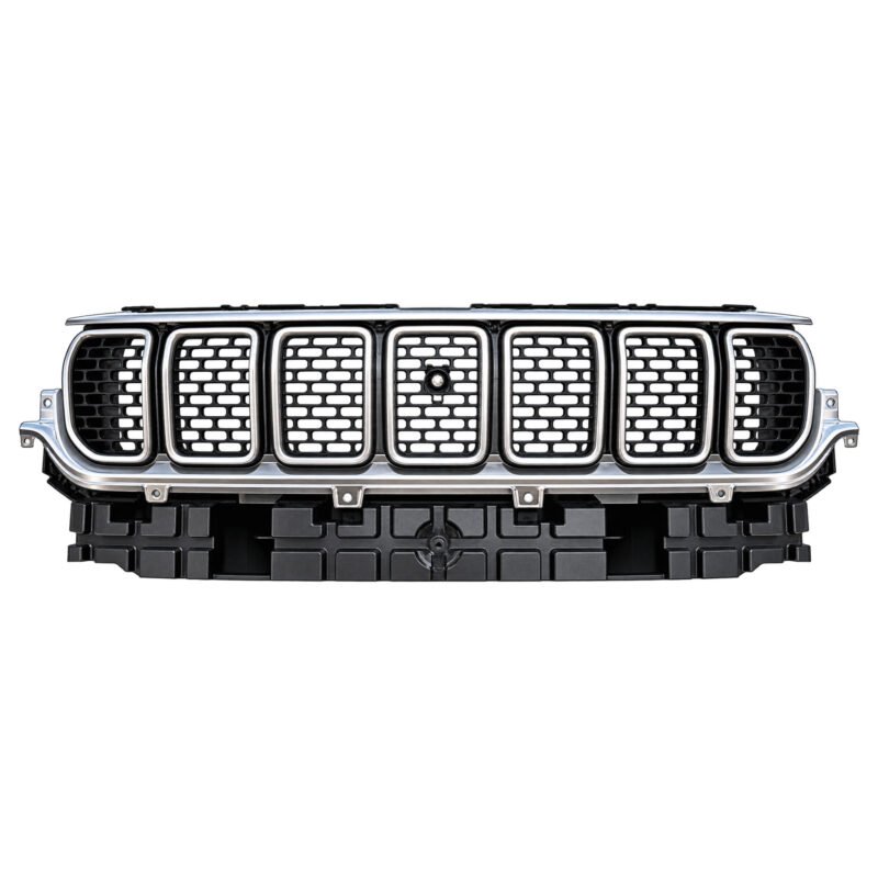 Wagoneer pearl nickel grille with bright slot borders, staggered mesh, a round centre feature and ribbed lower base